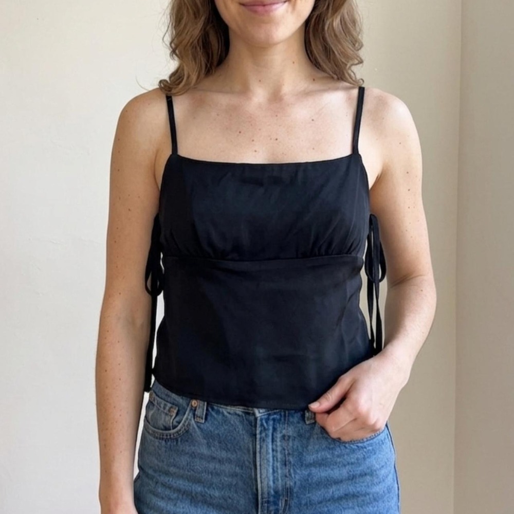 Black rayon crop top with cascading multi-tie shoulder straps and built-in cups